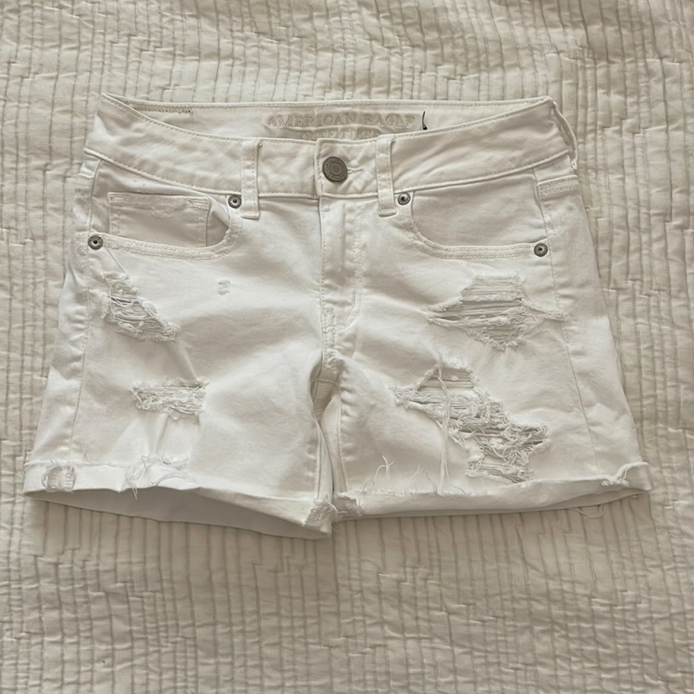 White stretchy distressed jean shorts